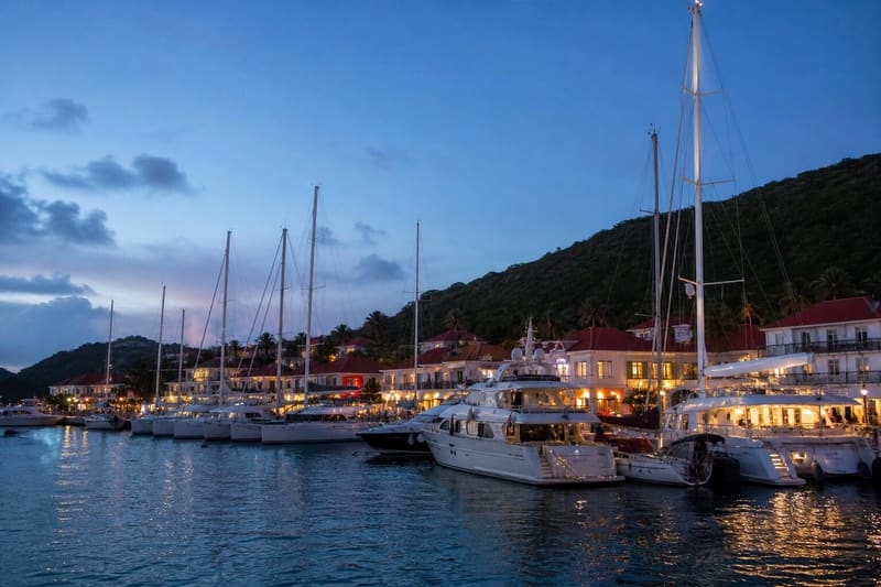 Gustavia harbour on St Barth in the evening, yachts moored stern-to along the quay.
