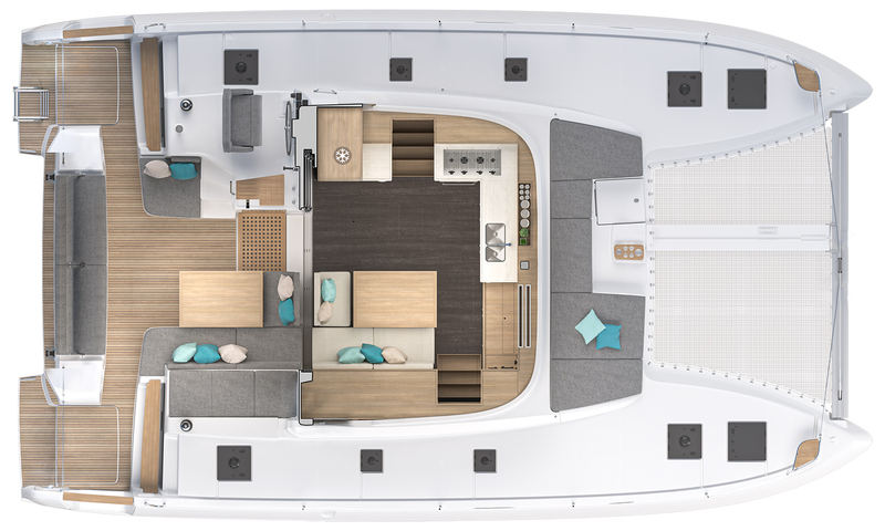 The same Lagoon 43 with the coachroof cut away: the saloon on the bridge deck between the hulls, galley along the port side, dining settee to starboard, opening straight out to the cockpit at one level.